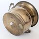 Vintage round cache-pot in hammered brass with decorative handles and patina.
