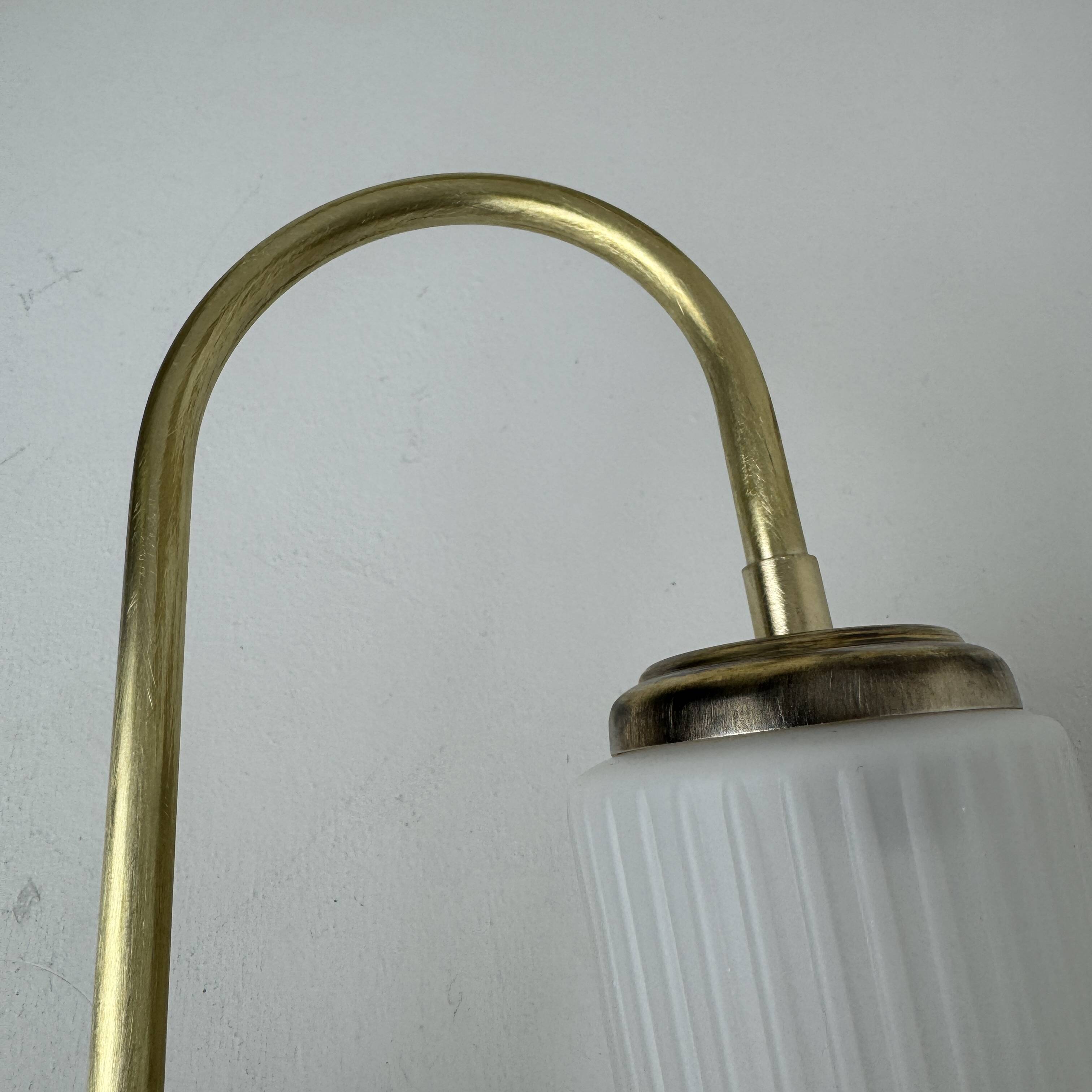 A pair of vintage opaline and brass wall lights