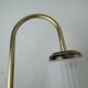 A pair of vintage opaline and brass wall lights