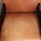 Ensemble de 2 fauteuils Art Déco en cuir de vache couleur cognac du 20e siècle.