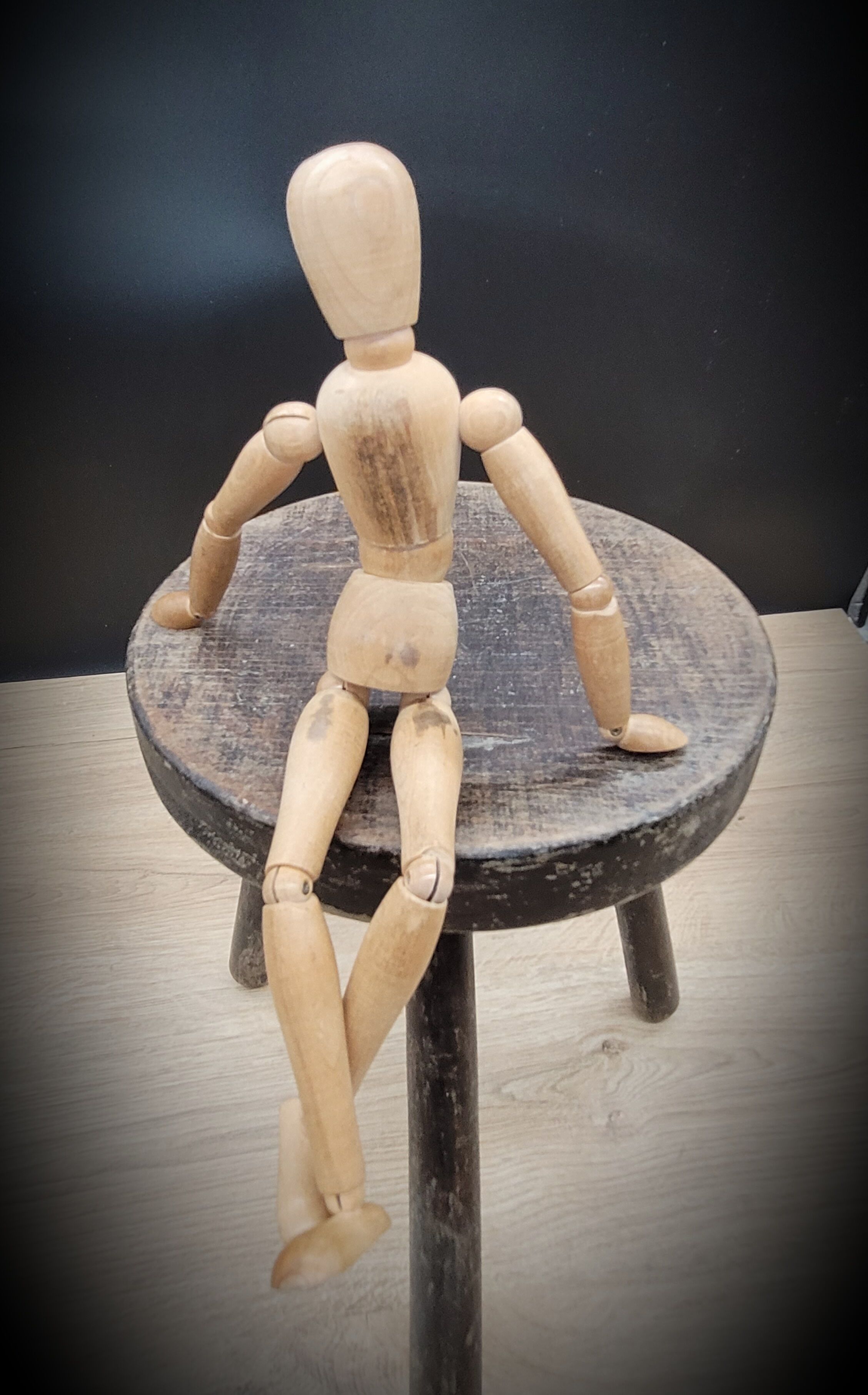 Massive black tripod stool