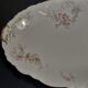 Plat de service ovale en porcelaine décor floral Charles Arhenfeldt Limoges