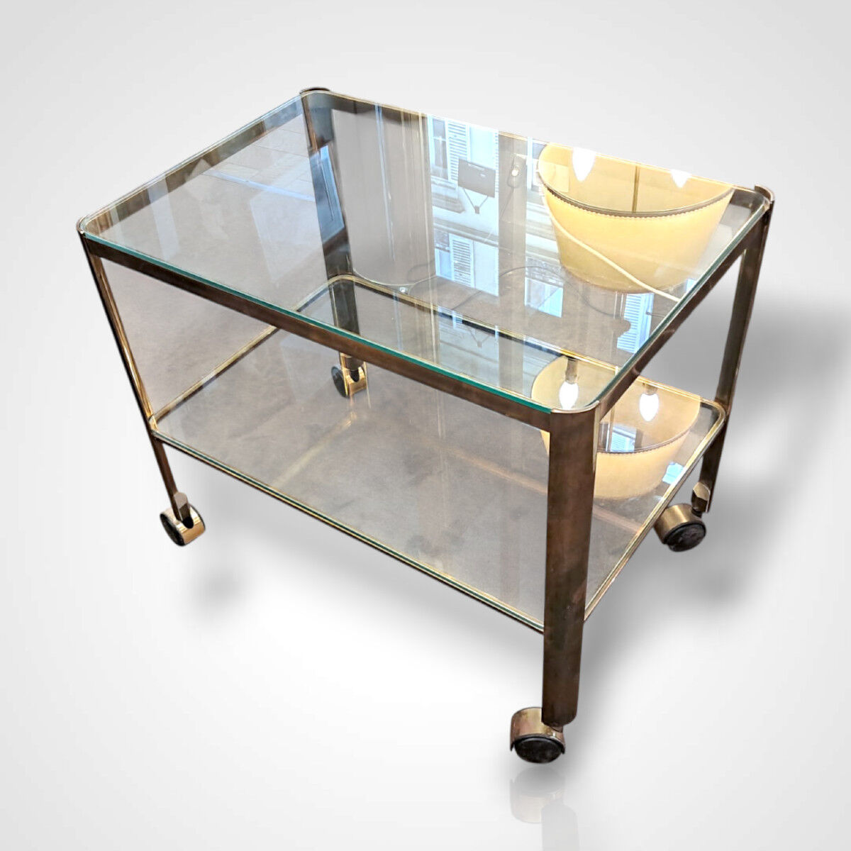 Jacques Quinet for Broncz, wheeled cart in bronze and glass, 20th century.