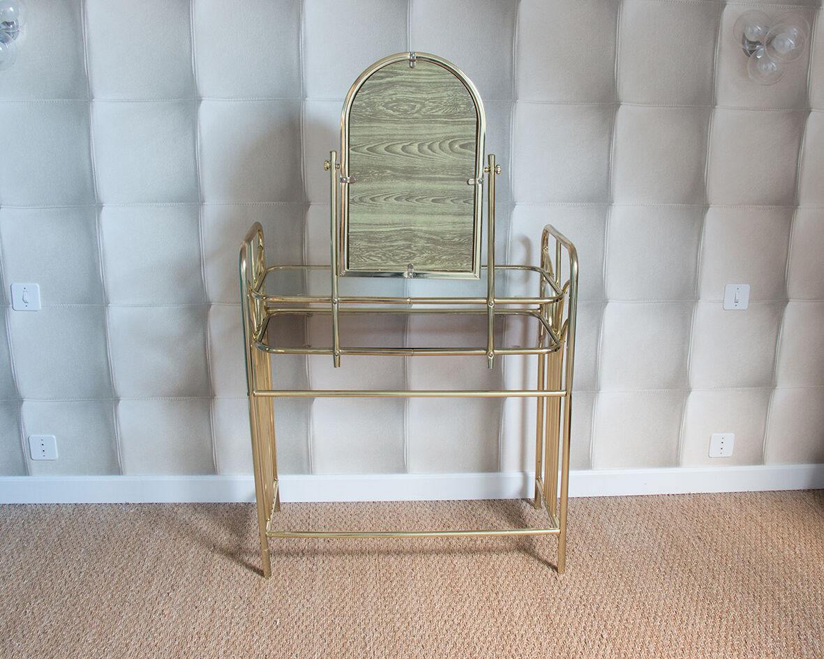 Dressing table in gold metal