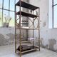 Rattan bookshelf and black glasses