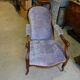 Relaxed Voltaire armchair with walnut racks