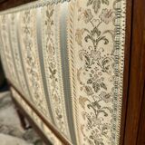 Low armchair in finely carved wood in the Louis XVI style from the 19th century