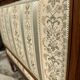 Low armchair in finely carved wood in the Louis XVI style from the 19th century