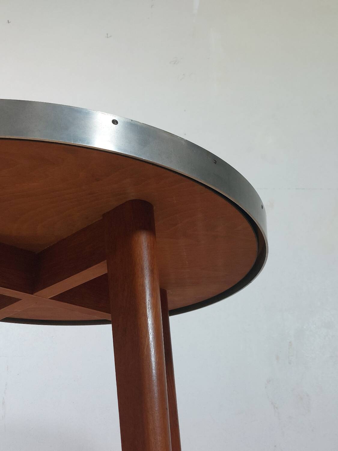 Vintage metal and teak side table from the 1950s.