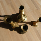 Set of 4 old candle holders in golden brass