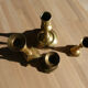 Set of 4 old candle holders in golden brass