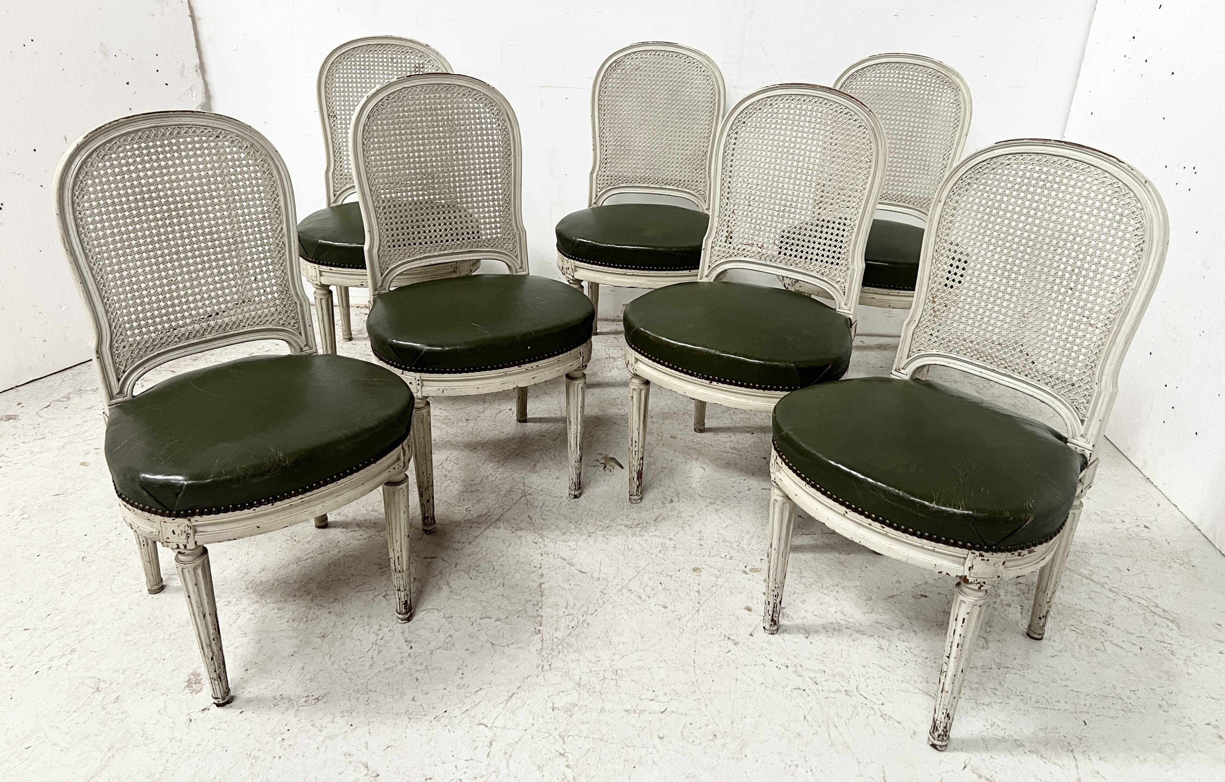 Set of seven Louis XVI style chairs in patinated beech, 20th century.