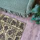 Romanian floral rug handwoven in wool, yellow and black background
