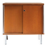 1970s low furniture in wood and metal with sliding doors.