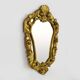 Old wall mirror in wood and gilded stucco with shell decoration, Louis XV style pediment mirror