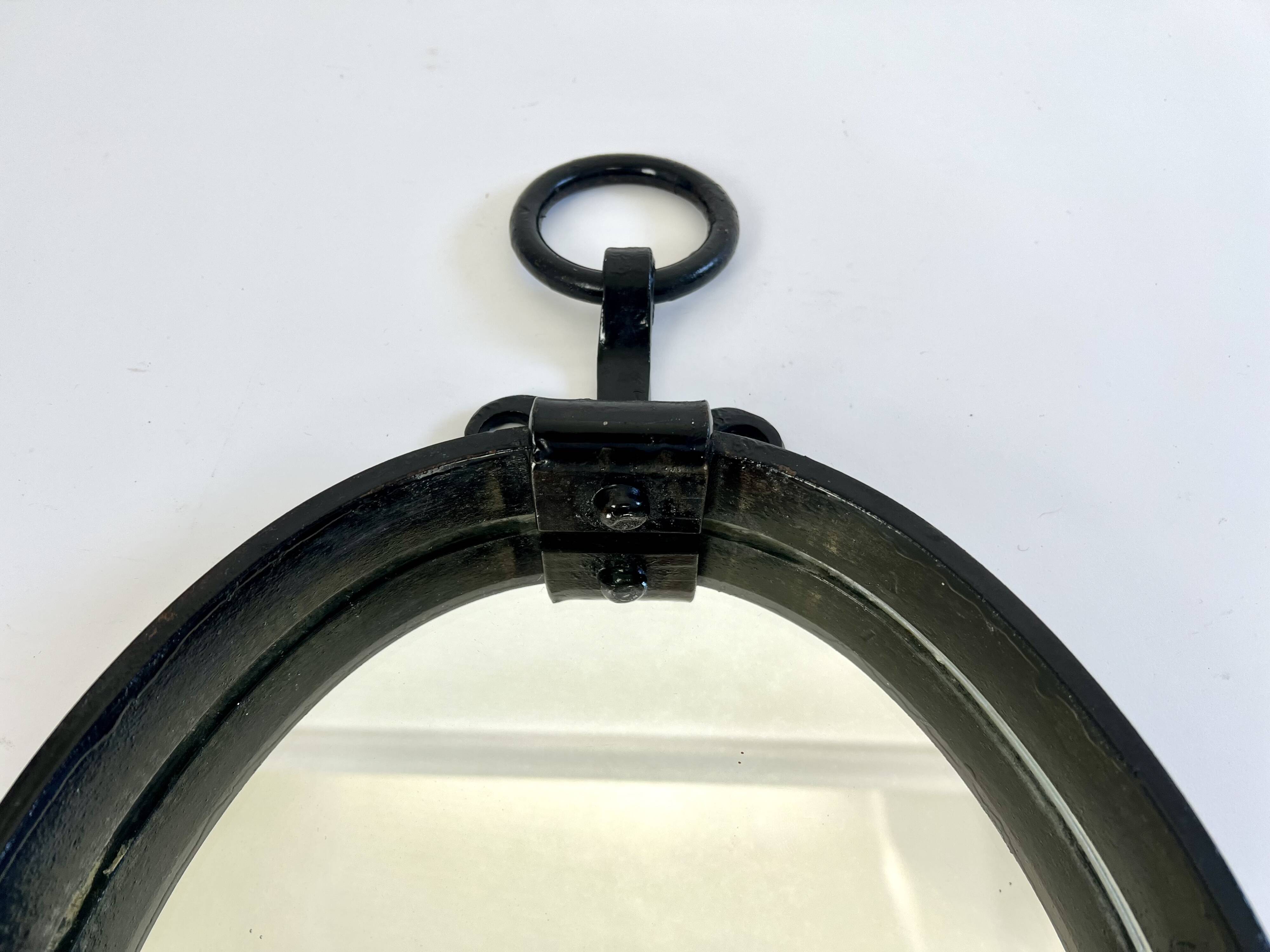 Miroir mural ovale brutaliste du milieu du siècle