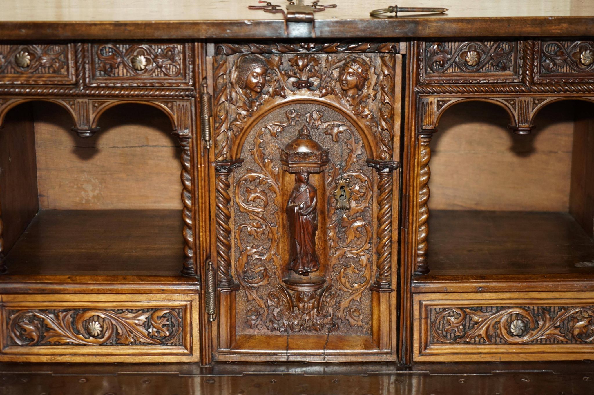 18th-century carved Spanish cabinet with hidden storage.