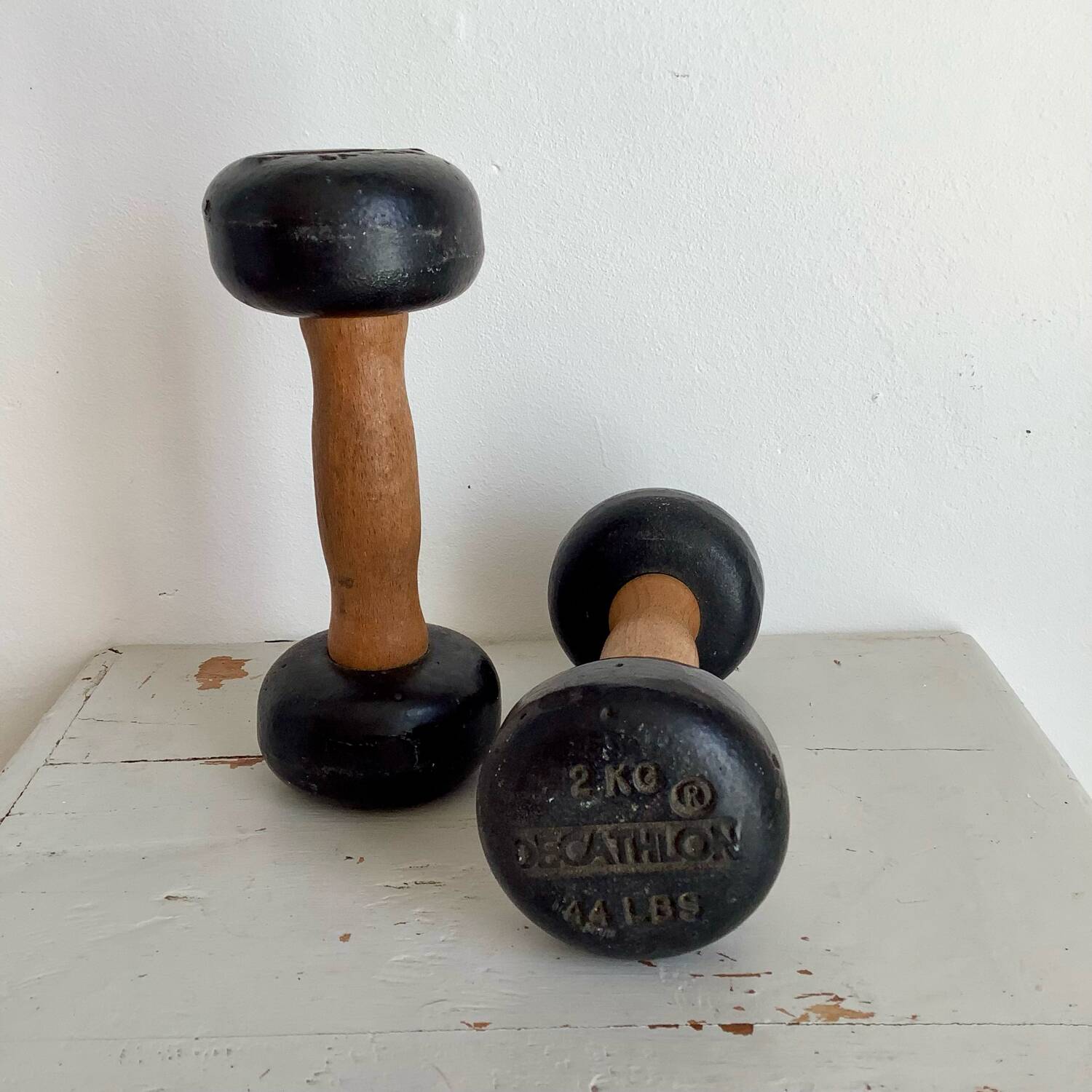 Pair of wooden and cast iron dumbbells