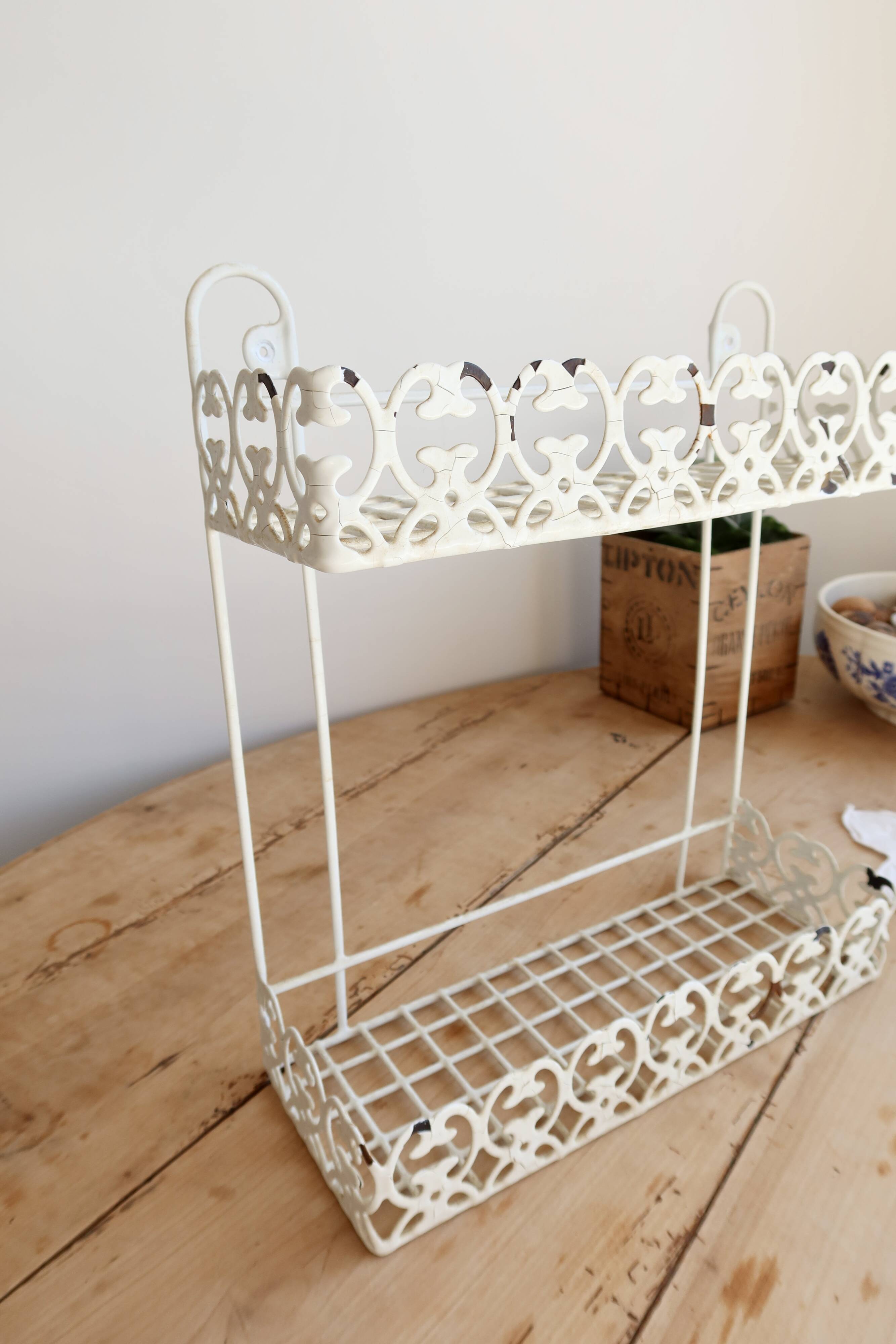 Vintage ivory patinated metal wall shelf