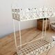 Vintage ivory patinated metal wall shelf