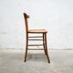 Chaise de bar vintage en bois par les éditions Luterma