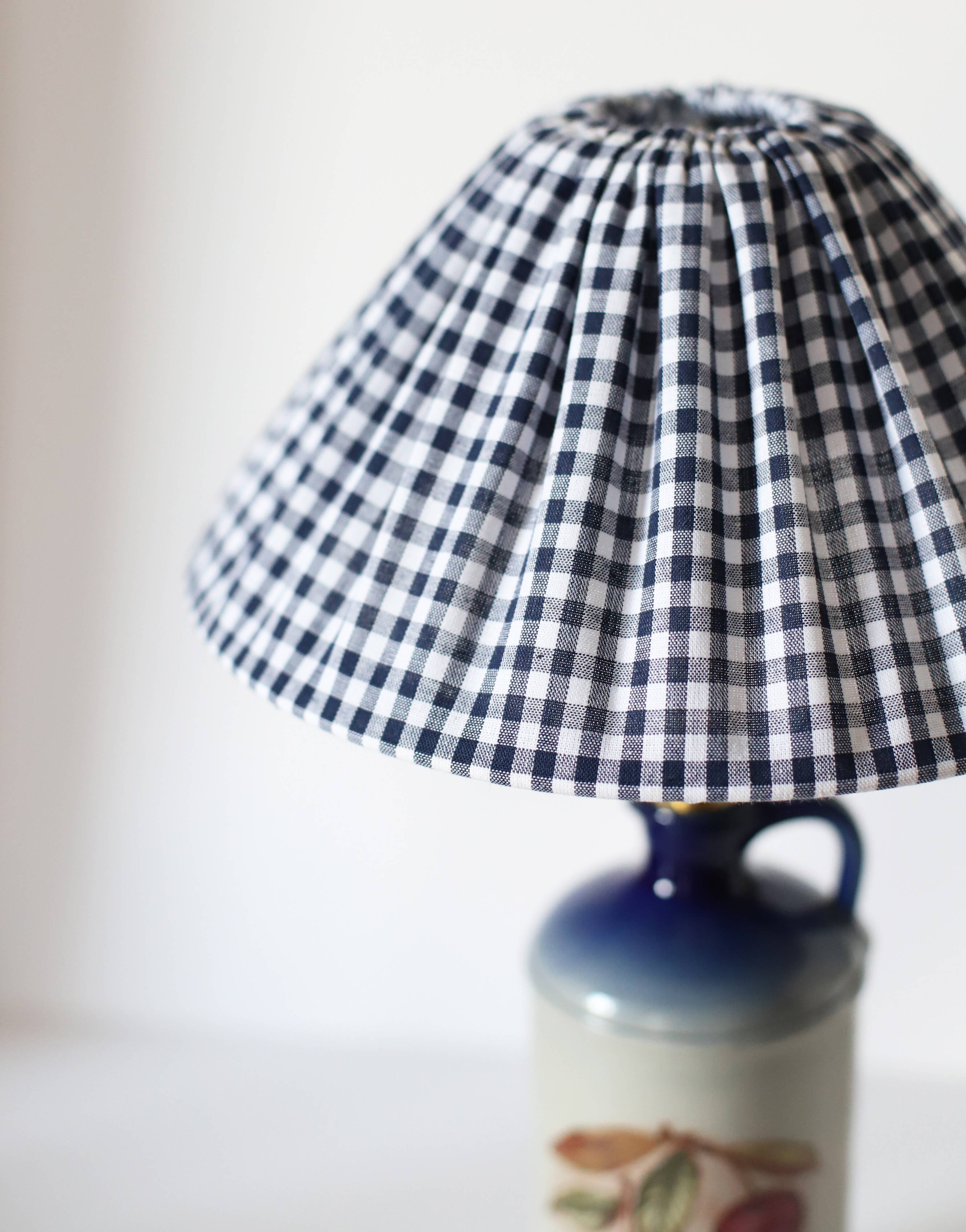 Table lamp with a base in Alsatian stoneware and a pleated gingham lampshade