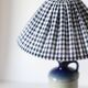 Table lamp with a base in Alsatian stoneware and a pleated gingham lampshade