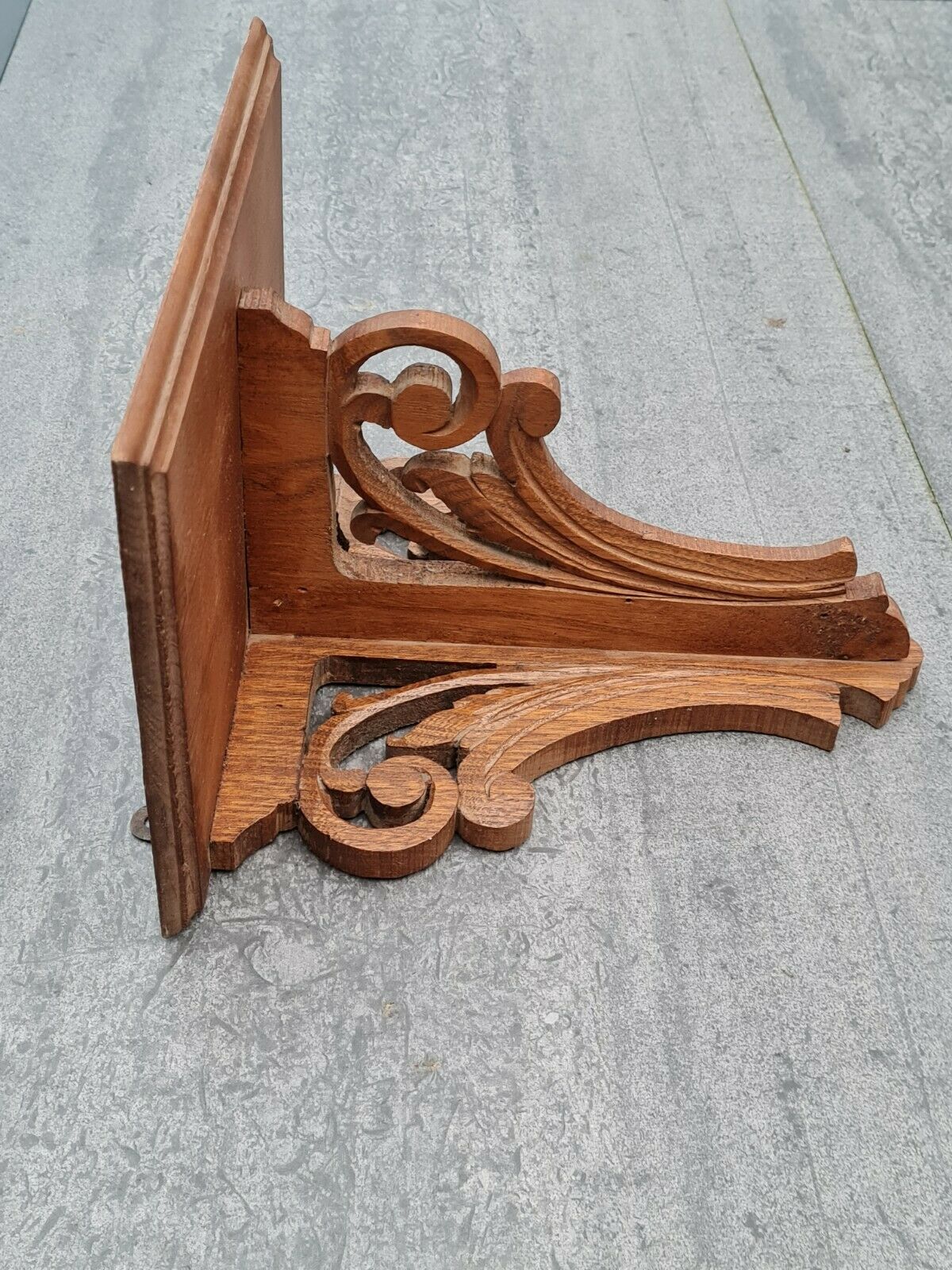 Openwork wooden wall shelf