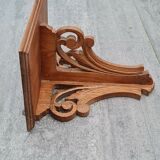 Openwork wooden wall shelf