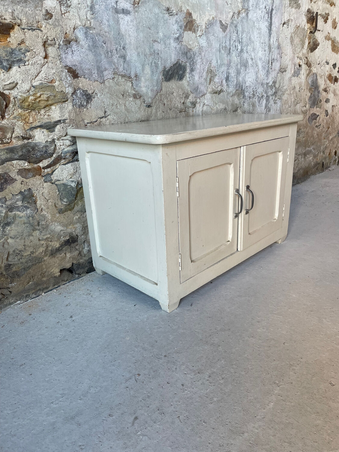 Antique white patinated low cabinet