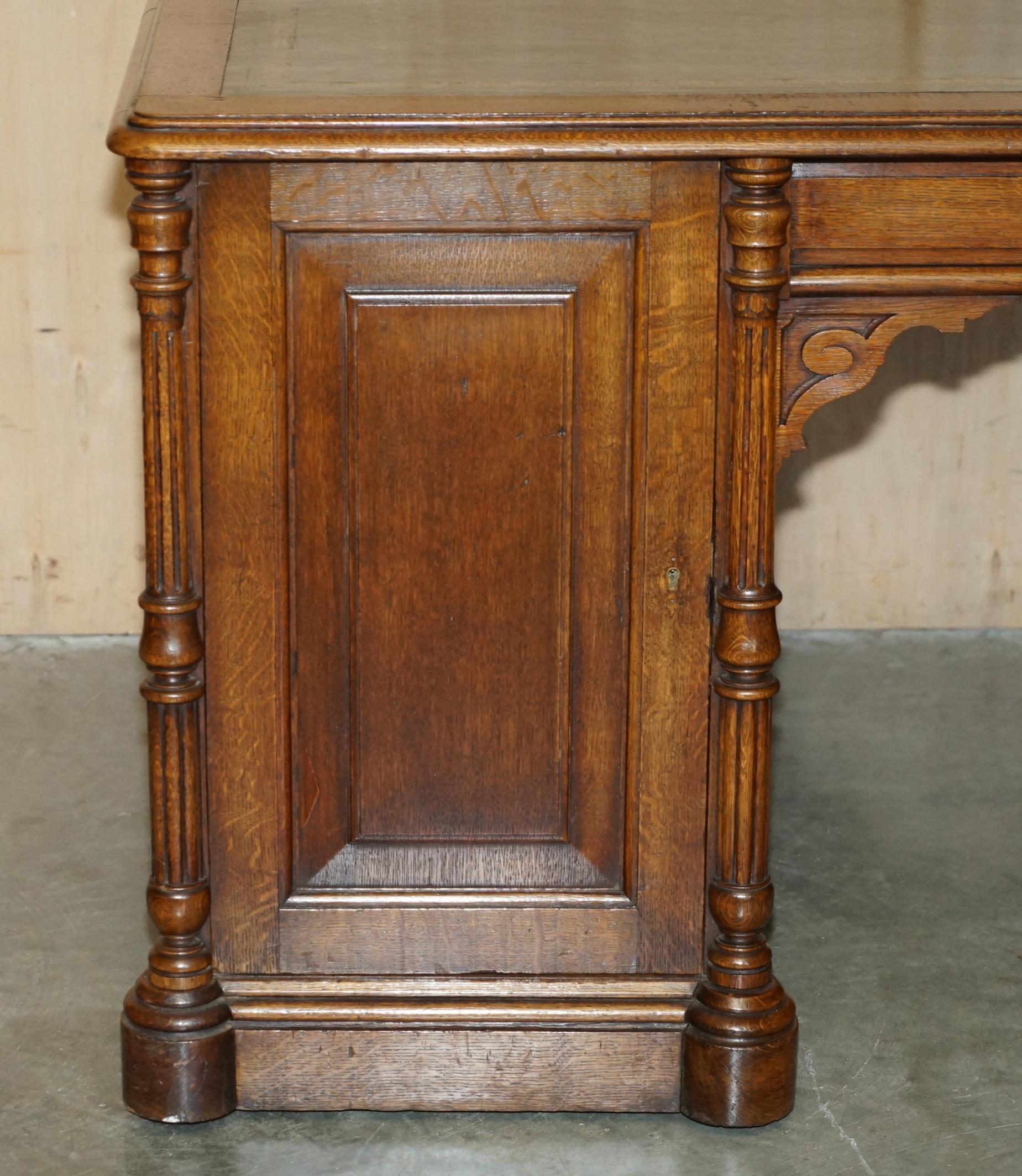 Antique double-sided desk C Hindley & Son in oak and leather