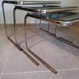 Set of 3 nesting tables with chrome metal legs and smoked glass from the 70s