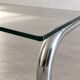 Coffee table in chrome with a glass top.