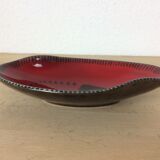 Empty black and red ceramic Elchinger pocket