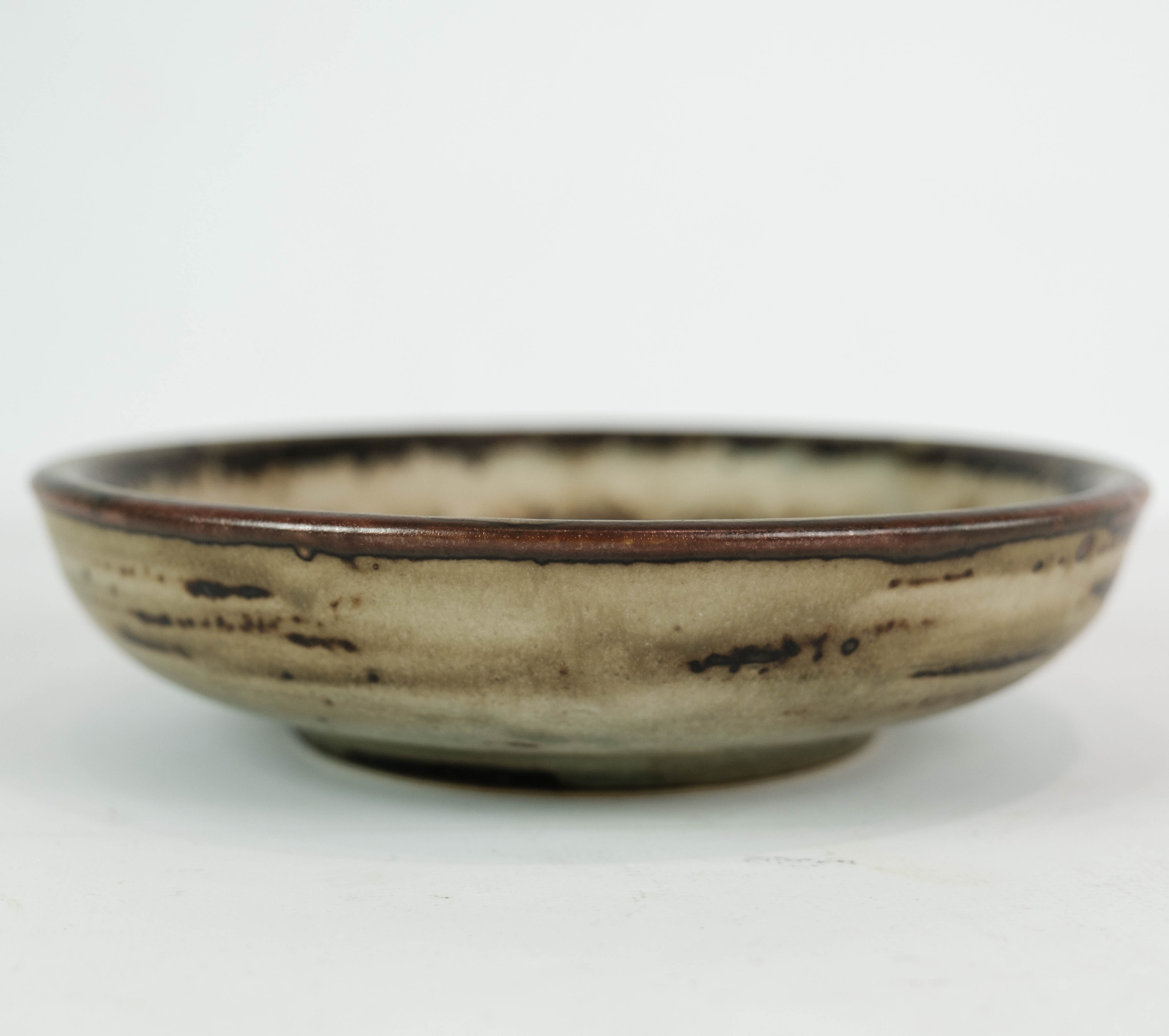 Stoneware bowl in brown colors, no.: 21567 by Gerd Bøgelund for Royal Copenhagen