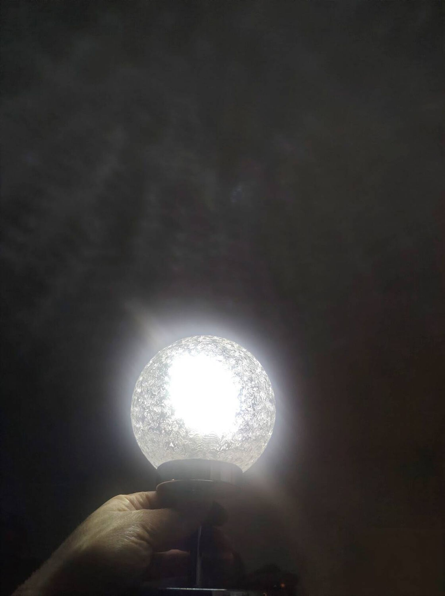 Duo of textured globe lamps with a large play of light.