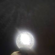 Duo of textured globe lamps with a large play of light.