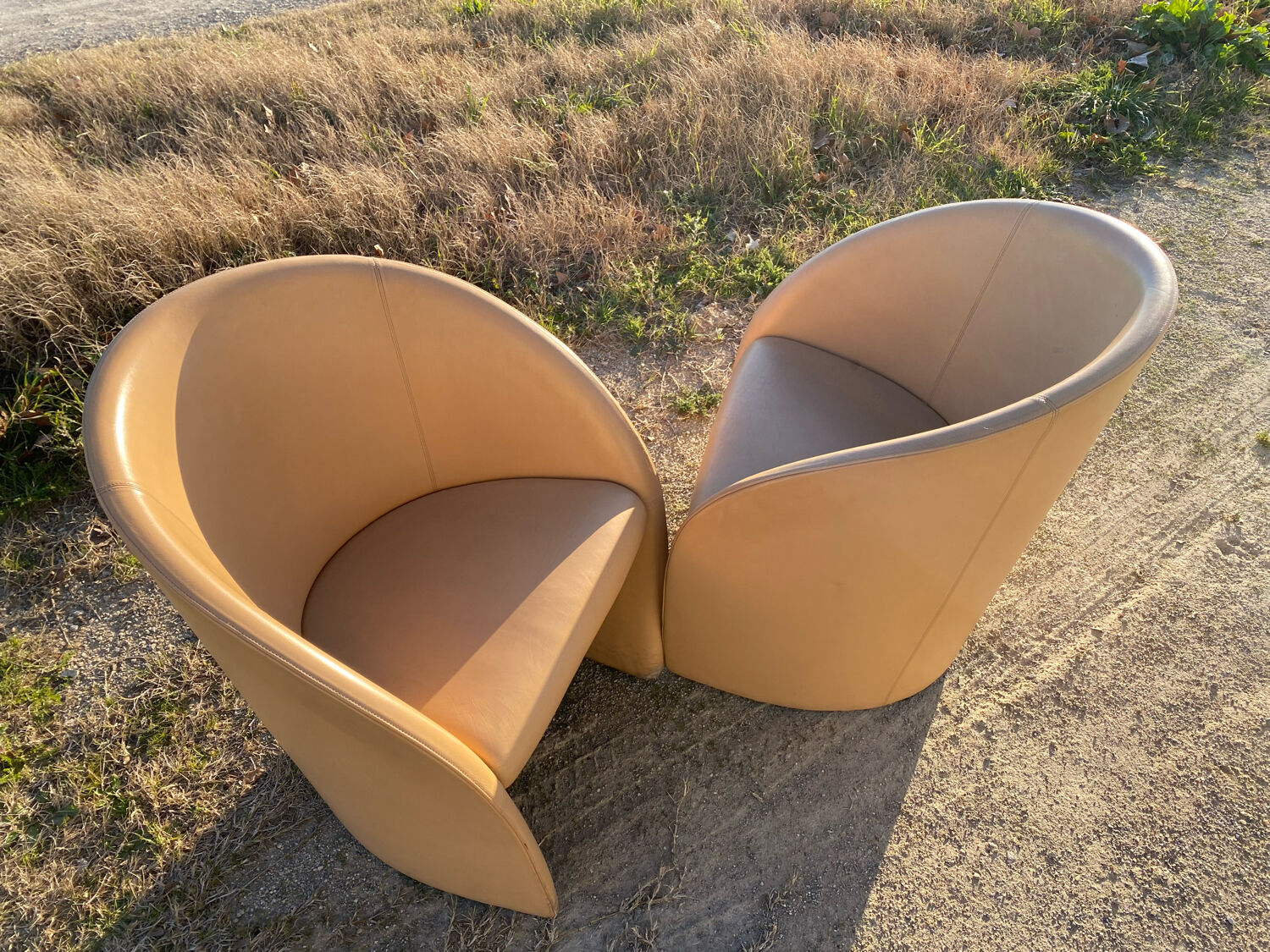 Pair of designer leather armchairs