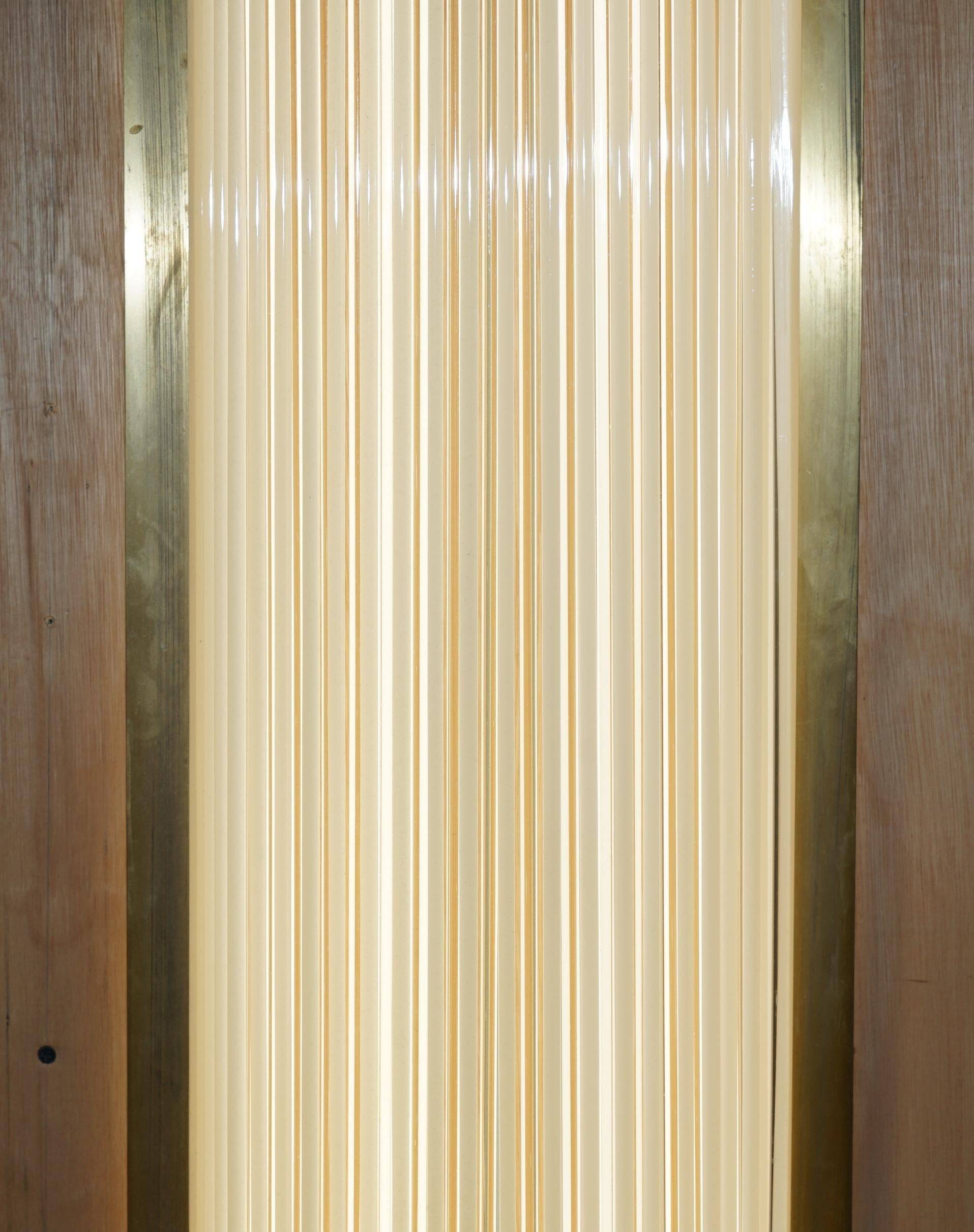 Pair of Art Deco wall sconces in brass and glass by Genet-Michon.