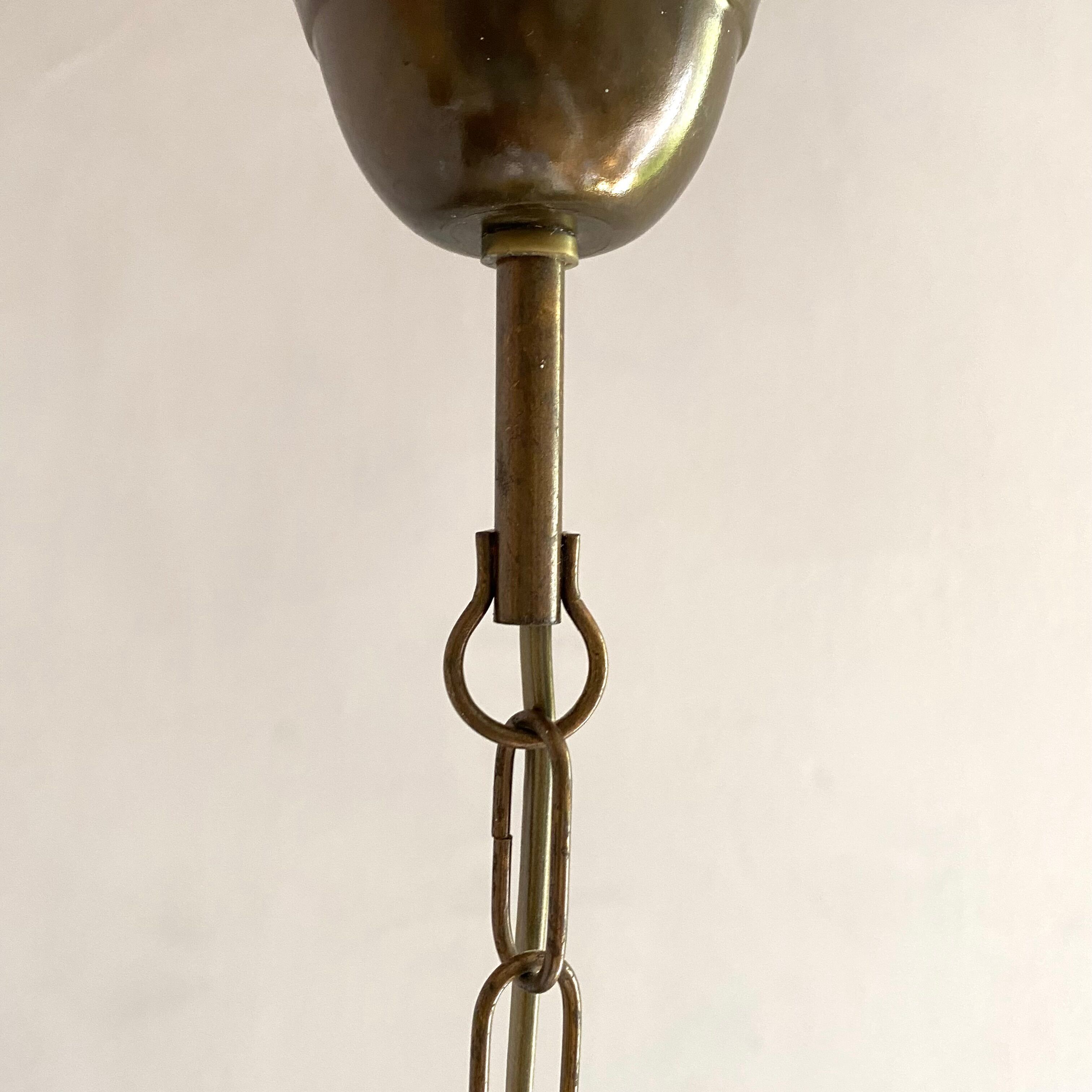 Pendant light in frosted glass and beads