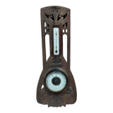 Old barometer and thermometer from the 1930s in carved wood. Signed on the back EH PARIS.