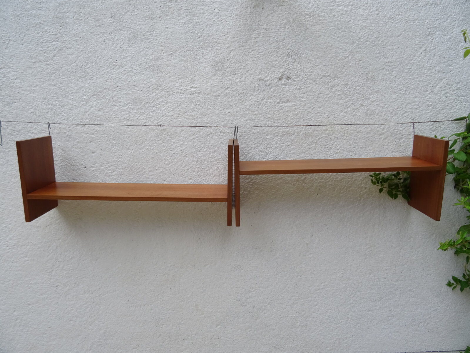 Pair of teak wall shelves