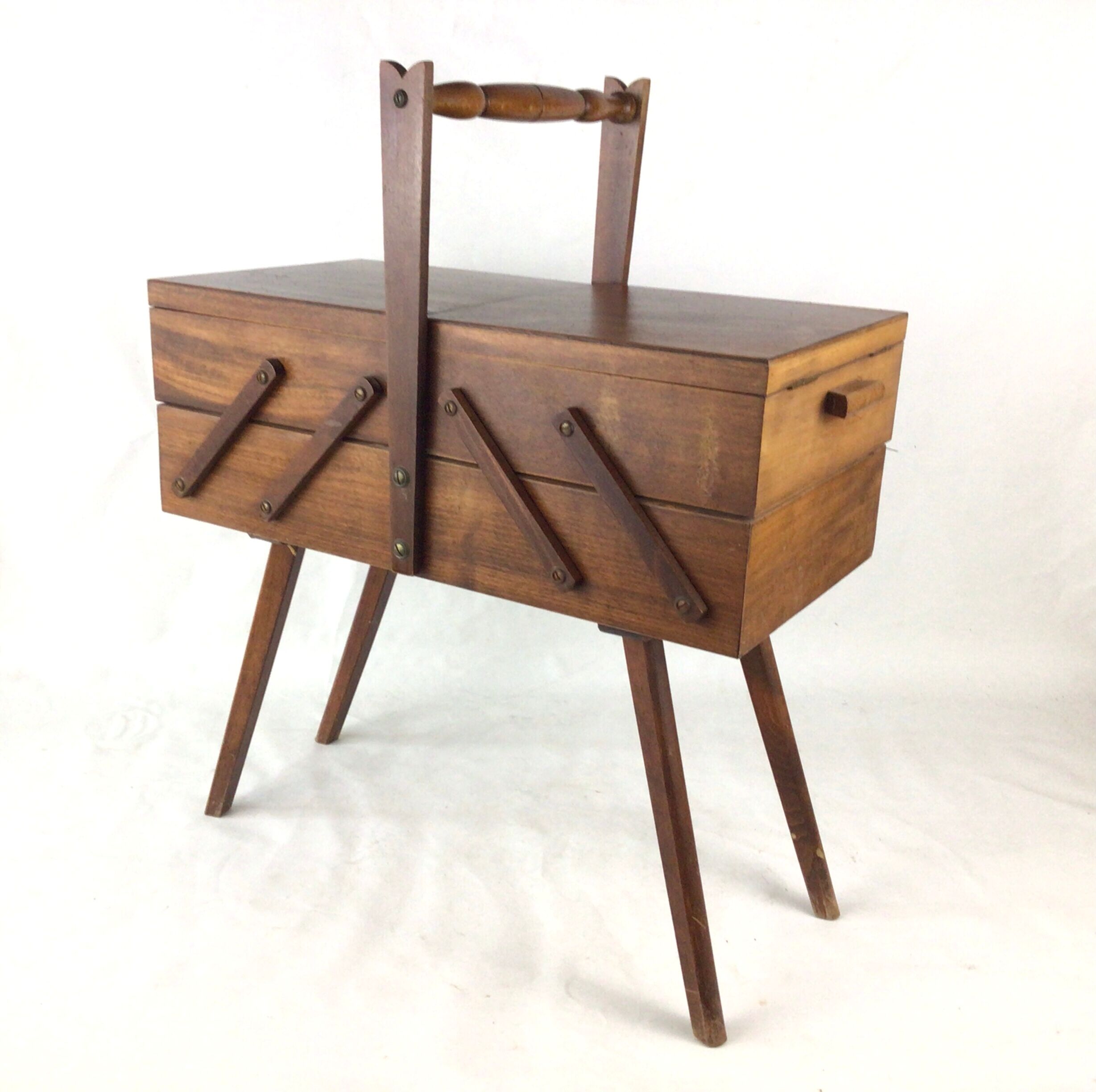 Worker on wooden compass feet