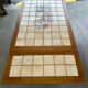 Vintage extendable dining table in wood and ceramic – 1970s