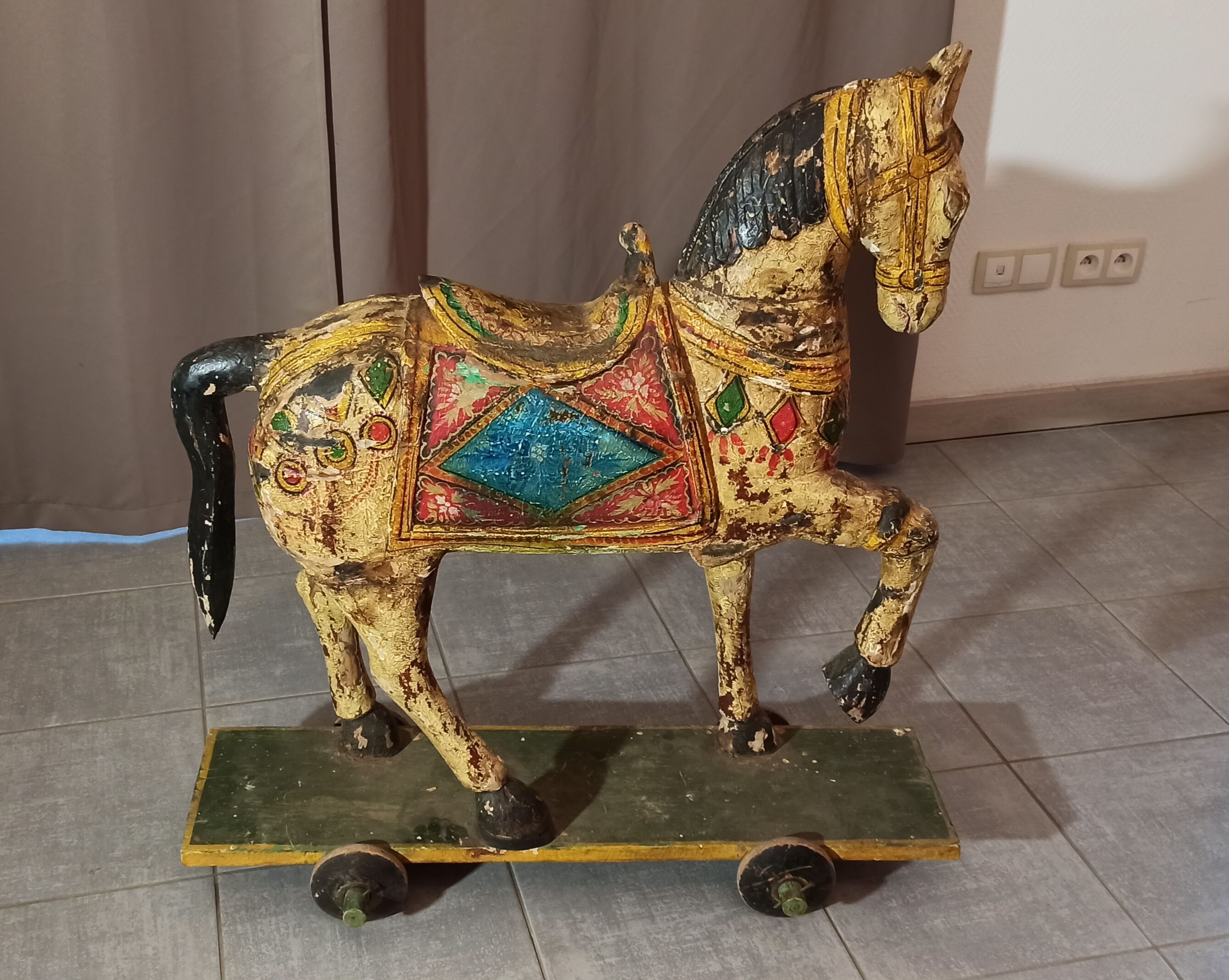 Old horse with wheels