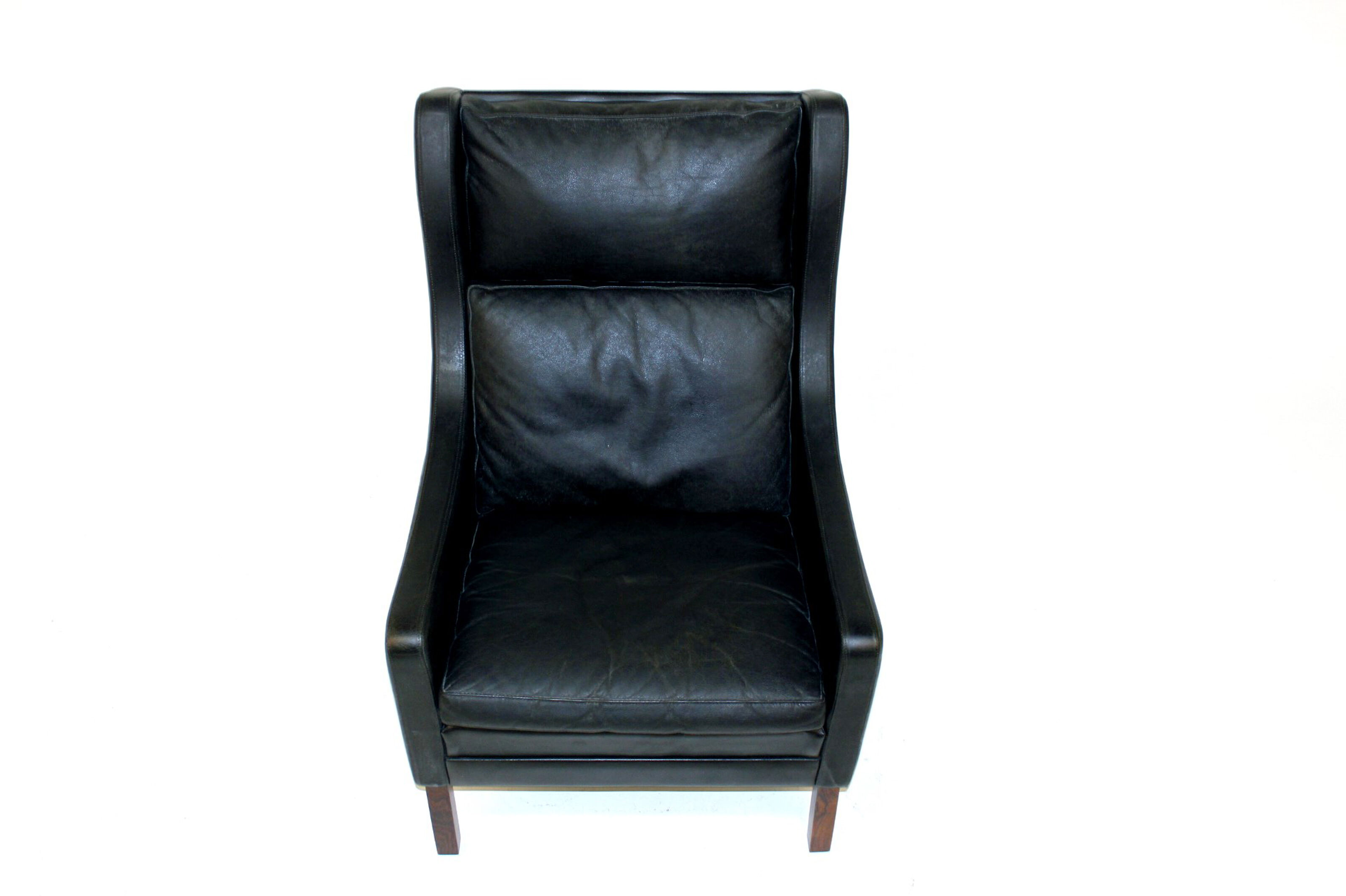 Fauteuil en cuir et palissandre Danemark 1960