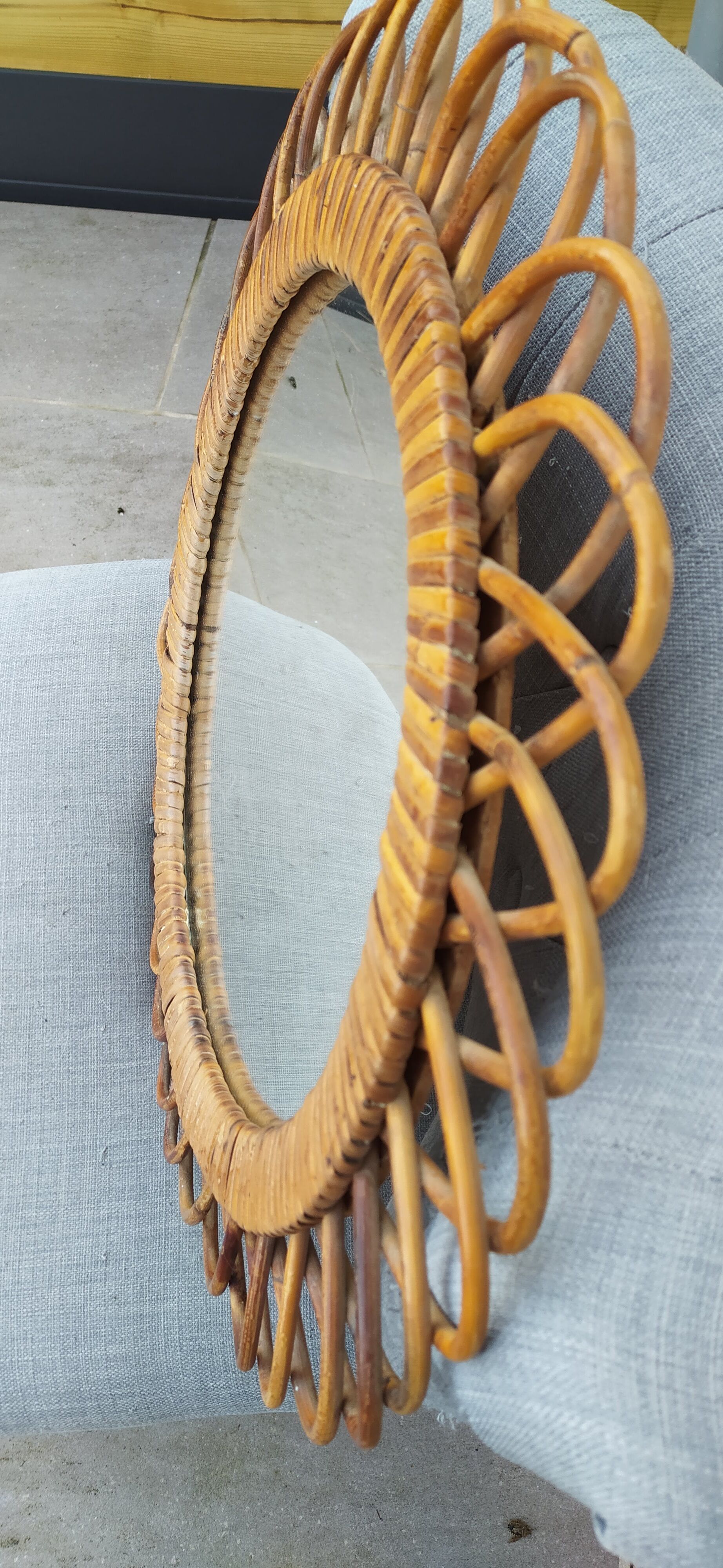 Vintage mirror in rattan flowers, sun