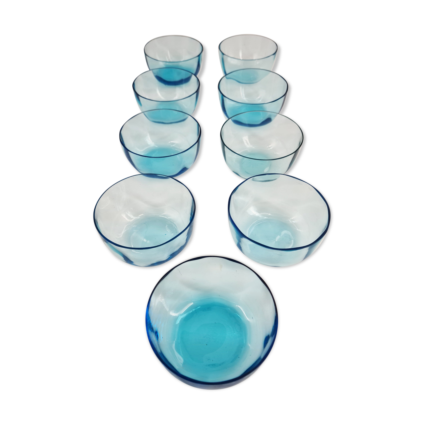Suite of 9 cups in pale blue crystal, XIX th