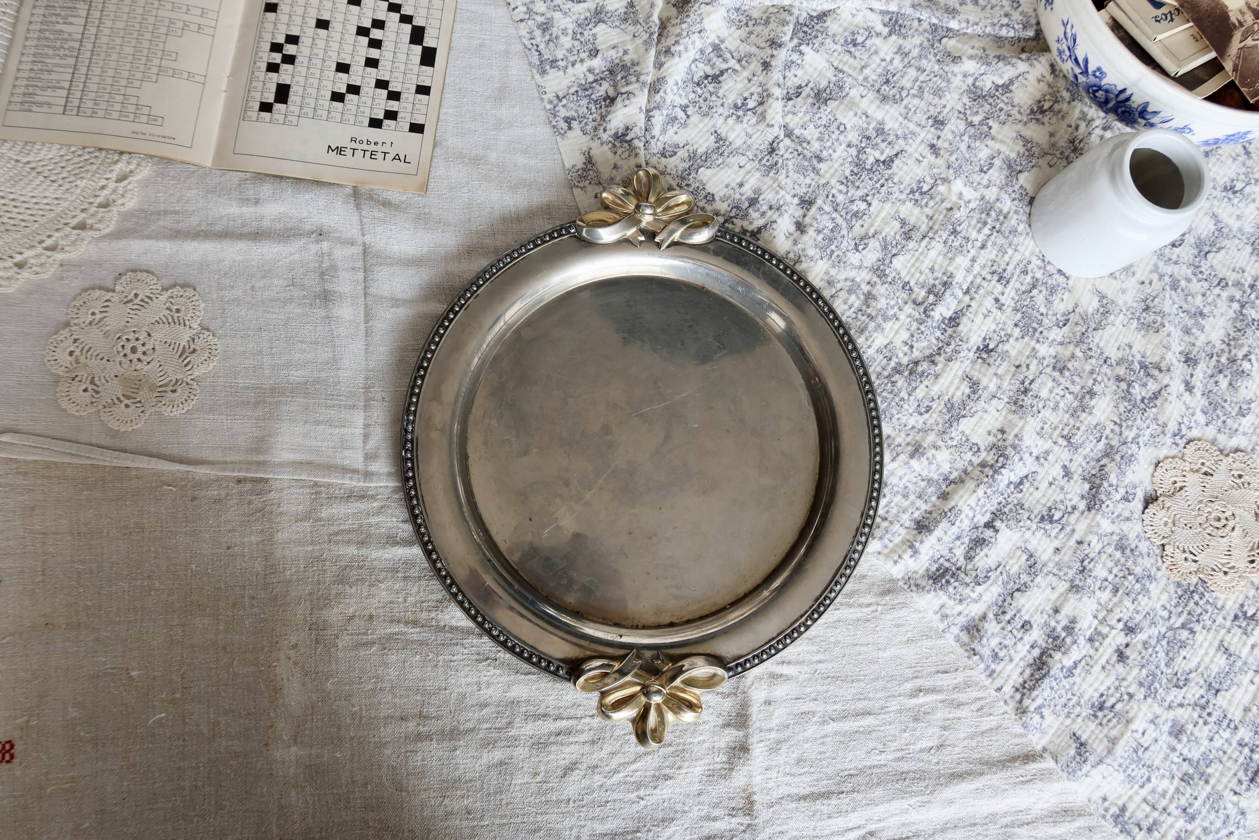 Vintage round silver metal serving tray with gold knot handles