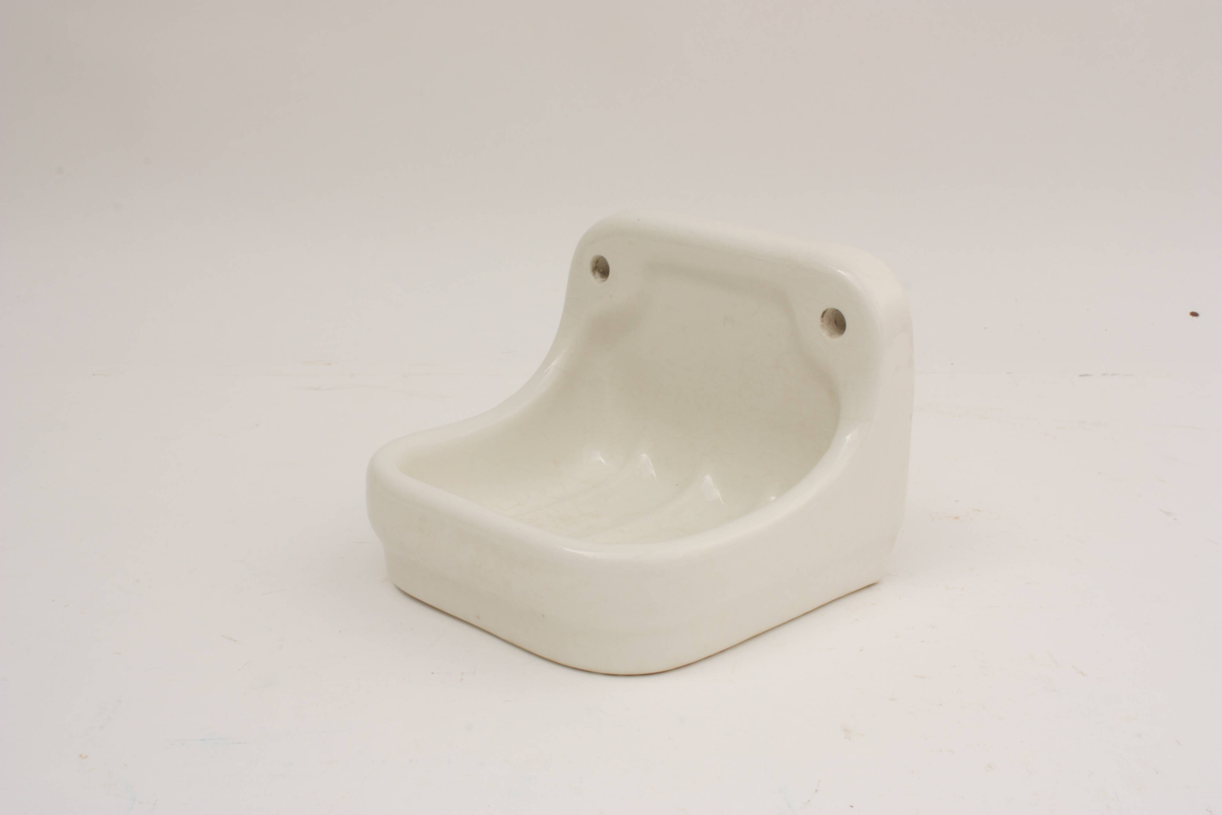 Wall-mounted earthenware soap dish